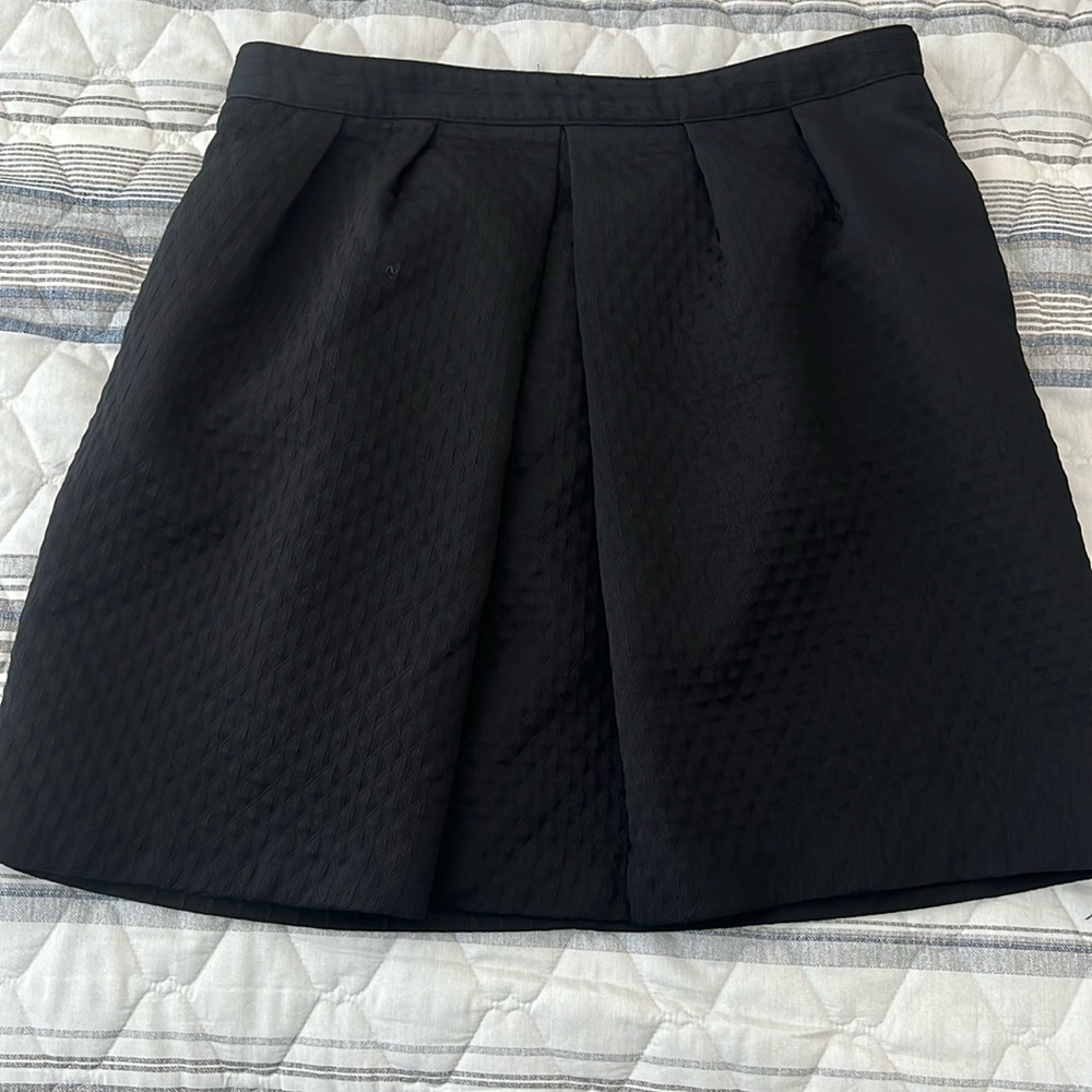 Pleated skirt with pockets